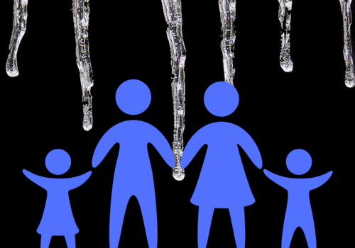 Family of two parents and two kids confront large icesicles